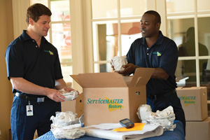 ServiceMaster professionals doing packout smoke damage home or office contents